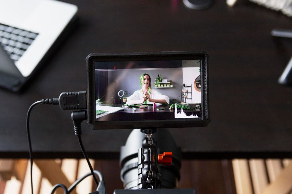 woman making beauty vlog with her professional camera web