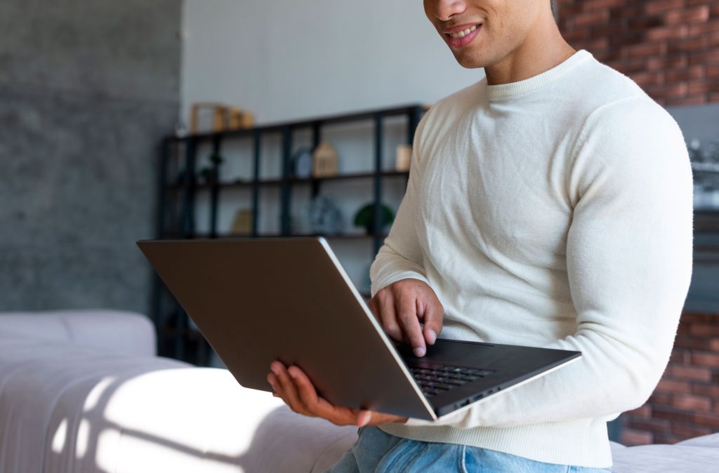 front view standing man using laptop web