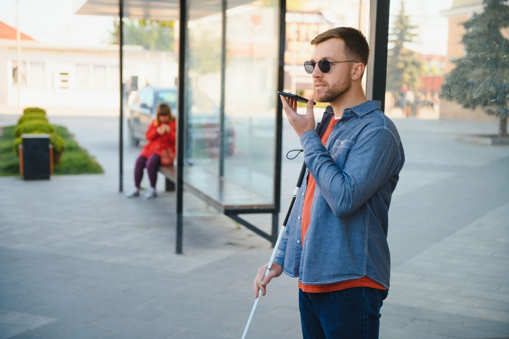 blinded man waiting bus bus station web