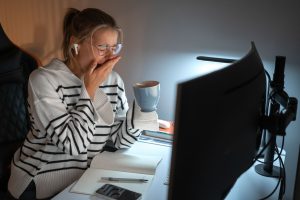 medium shot woman working late night