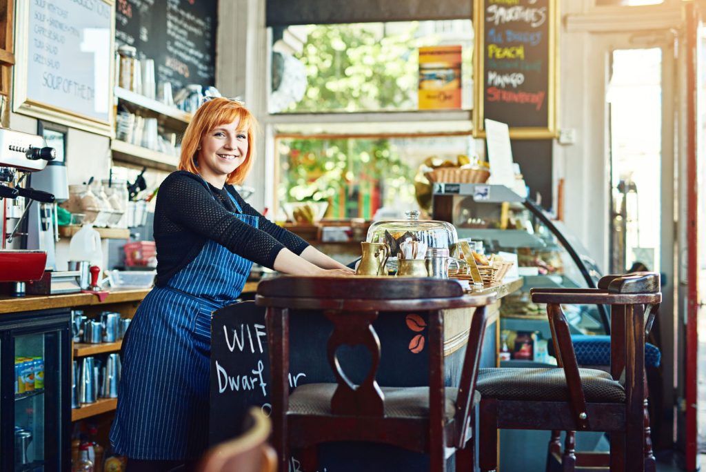 portrait waiter woman by counter cafe customer service cashier working coffee shop bistro startup small business female owner with smile store management serving barista